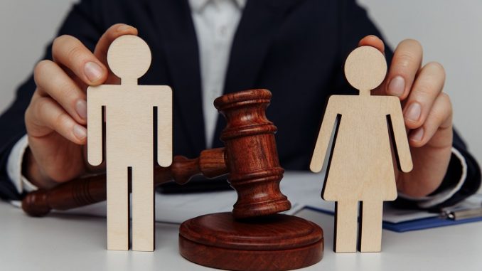 Lawyer or counselor holds figures of family, divorce or separati